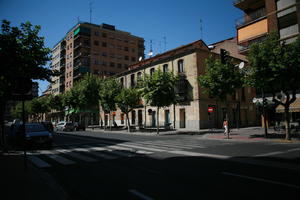 architecture, building, Castilla y Leon, day, eye level view, facade, road, Salamanca, Spain, street, summer, sunlight, sunny, sunshine, tree, vegetation