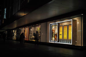 artificial lighting, England, eye level view, London, night, outdoor lighting, retail, shop, The United Kingdom