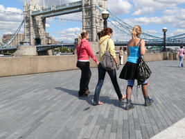 back, day, England, eye level view, group, lamppost, London, pavement, people, sunny, The United Kingdom, walking, woman