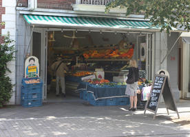 back, casual, day, eye level view, market, shop, sign, standing, street, summer, sunny, The Netherlands, Utrecht, Utrecht, vegetables, woman