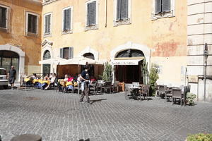 chair, day, eye level view, furniture, group, Italia , Lazio, people, restaurant, Rome, sitting, street, summer, sunny, table, umbrella