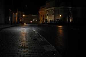 artificial lighting, city lights, eye level view, Kalisz, night, outdoor lighting, pavement, Poland, street, urban, wet, Wielkopolskie, winter