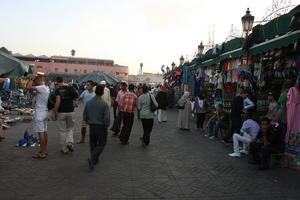 autumn, dusk, eye level view, group, man, market, Marrakech, Marrakesh, middleastern, Morocco, people, square, stall