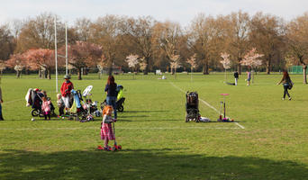 children, day, deciduous, England, eye level view, girl, grass, group, London, mother and child, park, people, picnicking, spring, sunny, The United Kingdom, tree