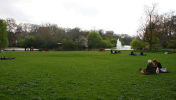 day, England, eye level view, girl, grass, greenery, group, London, park, people, sitting, spring, The United Kingdom, tree