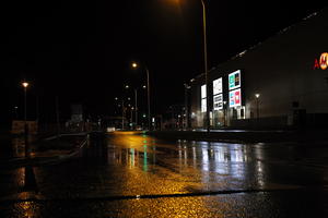 artificial lighting, city lights, eye level view, Kalisz, night, outdoor lighting, Poland, street, urban, wet, Wielkopolskie, winter