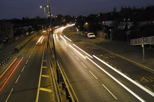 artificial lighting, car, car lights, city lights, elevated, England, evening, lamppost, London, night, outdoor lighting, road, The United Kingdom, traffic, urban, winter