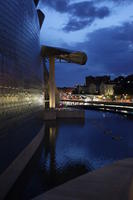 artificial lighting, Bilbao, building, canopy, evening, eye level view, facade, Guggenheim Museum, museum, Pais Vasco, pond, Spain