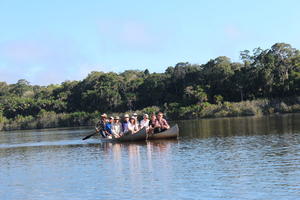 boat, day, eye level view, group, Madre de Dios, people, Peru, river, sailing, shrub, summer, sunny, treeline, tropical