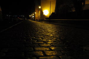 artificial lighting, city lights, eye level view, Kalisz, lowered, night, outdoor lighting, pavement, Poland, street, urban, wet, Wielkopolskie, winter