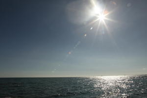 autumn, Barcelona, bright, Cataluña, clear, day, eye level view, reflected, seascape, sky, Spain, sun, sun glare, sunny, water, waves