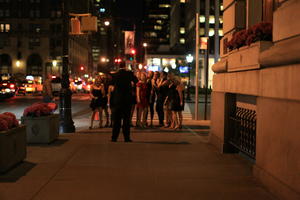 artificial lighting, eye level view, group, Manhattan, New York, night, people, street, The United States, woman