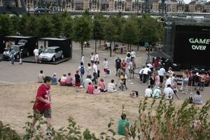 casual, day, elevated, England, exhibition, group, London, park, people, sitting, The United Kingdom, tree, vegetation, walking