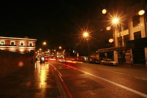 artificial lighting, car, effect, England, eye level view, London, night, street, The United Kingdom, transport