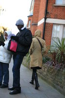 afrocarribean, afternoon, boy, day, England, eye level view, London, man, natural light, people, standing, street, The United Kingdom, vegetation, walking, winter, winter