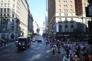 building, crowd, day, elevated, Manhattan, New York, people, policeman, standing, street, summer, sunny, The United States, truck, walking