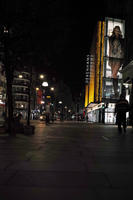 artificial lighting, city lights, England, eye level view, London, lowered, night, outdoor lighting, retail, shop, street, The United Kingdom