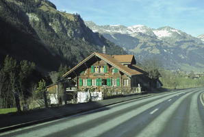 bright, chalet, cliffs, day, eye level view, mountain, nature, open space, outdoors, road, snow, sunlight, sunny, Switzerland, Valais, winter