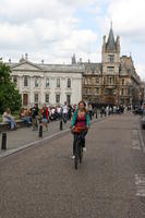 afternoon, Cambridge, cycling, day, England, eye level view, people, sitting, spring, street, The United Kingdom, walking, woman