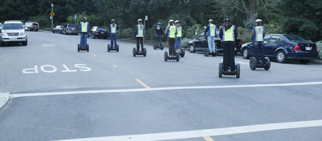 back, California, diffuse, diffused light, evening, eye level view, group, people, riding, San Francisco, segway, street, summer, The United States