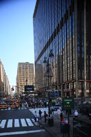 building, car, crossing, crowd, day, elevated, facade, group, lamppost, Manhattan, New York, people, sign, standing, street, summer, sunny, taxi, The United States, walking