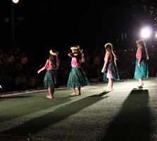 artificial lighting, dancing, evening, eye level view, girl, Hawaii, outdoor lighting, people, performer, stage, summer, The United States, youngster