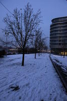 artificial lighting, building, dusk, England, eye level view, London, snow, The United Kingdom, track, tree