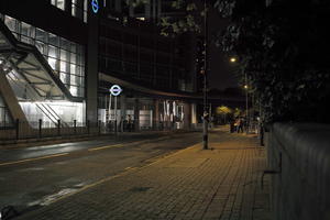 artificial lighting, England, eye level view, London, night, pavement, street, The United Kingdom