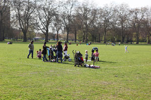 day, deciduous, England, eye level view, grass, group, London, mother and child, park, people, picnicking, spring, sunny, The United Kingdom, tree