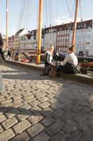 Copenhagen , day, lowered, pavement, promenade, sitting, sunny, winter, winter, woman