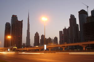 artificial lighting, cityscape, Dubai, Dubayy, dusk, eye level view, flyover, lamppost, outdoor lighting, road, skyscraper, The United Arab Emirates