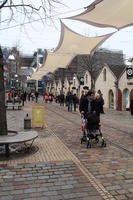 canopy, day, eye level view, family, France, group, Ile-De-France, natural light, overcast, Paris, pavement, people, street, walking, winter