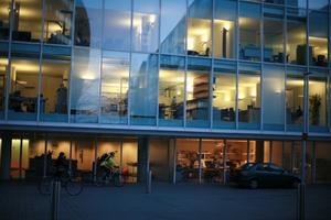 architecture, artificial lighting, building, car, cycling, dusk, England, eye level view, facade, glass, London, office, The United Kingdom, urban