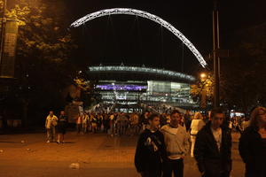 artificial lighting, crowd, England, eye level view, London, night, people, stadium, structure, The United Kingdom