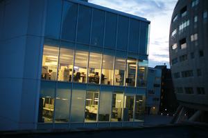 artificial lighting, building, dusk, England, evening, eye level view, facade, London, office, spring, The United Kingdom