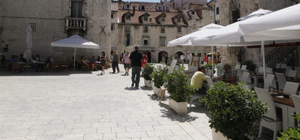 cafe, casual, Croatia, day, eye level view, furniture, parasol, pavement, people, plaza, potted plant, sitting, Split, Splitsko-Dalmatinska, square, summer, summer, sunny, walking