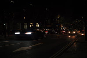 artificial lighting, car, car lights, England, eye level view, London, night, spring, street, The United Kingdom, urban