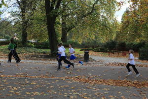 afternoon, autumn, Battersea park, child, day, England, eye level view, group, leaf, London, park, path, running, The United Kingdom, tree