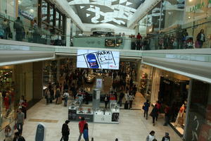 day, display, elevated, England, group, indoor lighting, interior, London, mall, natural light, people, retail, shop, shopping, shopping centre, The United Kingdom, walking