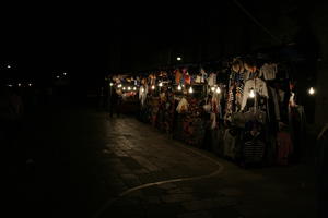 artificial lighting, clothing, eye level view, Italia , night, outdoor lighting, pavement, stall, stand, street, Veneto, Venice