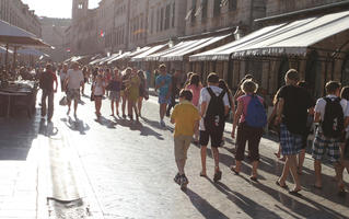 afternoon, backlight, cafe, canopy, casual, Croatia, day, Dubrovacko-Neretvanska, Dubrovnik, eye level view, group, people, square, summer, sunny, umbrella, walking