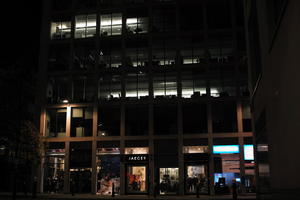 artificial lighting, building, city, city lights, England, eye level view, facade, London, night, outdoor lighting, shop, The United Kingdom, urban