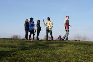 day, England, eye level view, grass, group, hill, Oxford, people, standing, sunny, The United Kingdom, vegetation, winter