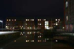 artificial lighting, building, canal, city, city lights, England, eye level view, facade, Gloucester, night, outdoor lighting, reflected, residential, The United Kingdom, urban