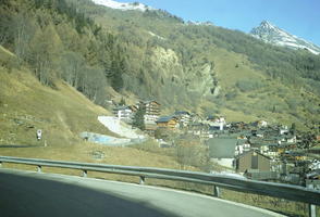 bright, chalet, cliffs, day, eye level view, mountain, nature, open space, outdoors, road, rocks, sunlight, sunny, Switzerland, Valais, valley, village, winter