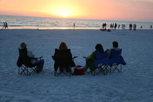 beach, England, eye level view, Florida, group, London, Sarasota, sitting, sunny, sunset, sunshine, The United Kingdom, The United States, winter