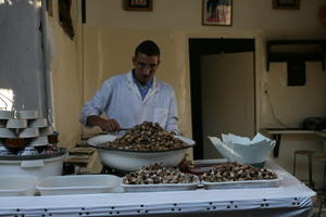 arabic, day, eye level view, food, man, Marrakech, Marrakesh, Morocco, natural light, portrait, stall