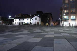 artificial lighting, building, city, city lights, England, eye level view, Gloucester, house, lowered, night, outdoor lighting, pavement, square, The United Kingdom, urban