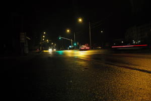 artificial lighting, city lights, eye level view, Kalisz, lowered, night, outdoor lighting, Poland, street, urban, wet, Wielkopolskie, winter