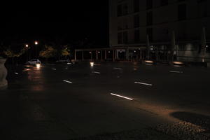 artificial lighting, building, city, Croatia, eye level view, night, pavement, pavement, paving, plaza, spring, wet, Zadar, Zadarska